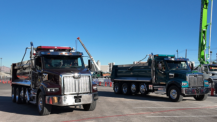 two monster dump trucks